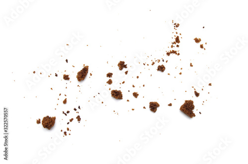 Scattered crumbs of chocolate chip cookies isolated on white background. photo