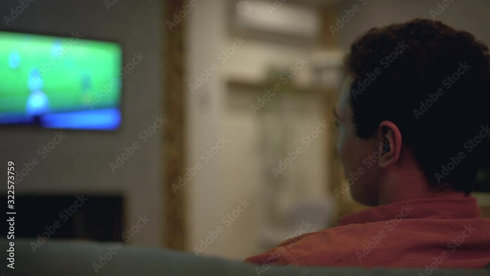 Sports fan upset with football match result, watching game on tv home, betting Sports fan upset with football match result, watching game on tv home, betting