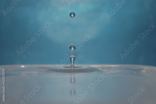 water drop in front of blue background