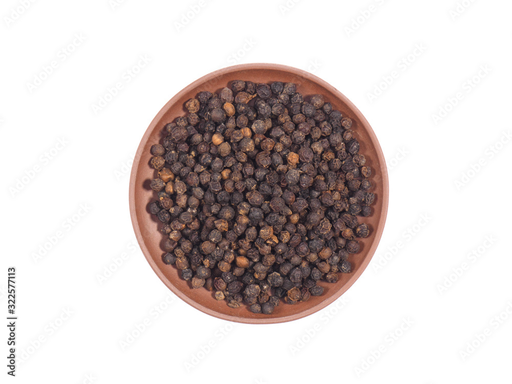 Spice black pepper in clay plate isolated on white Spice black pepper in clay plate isolated on white