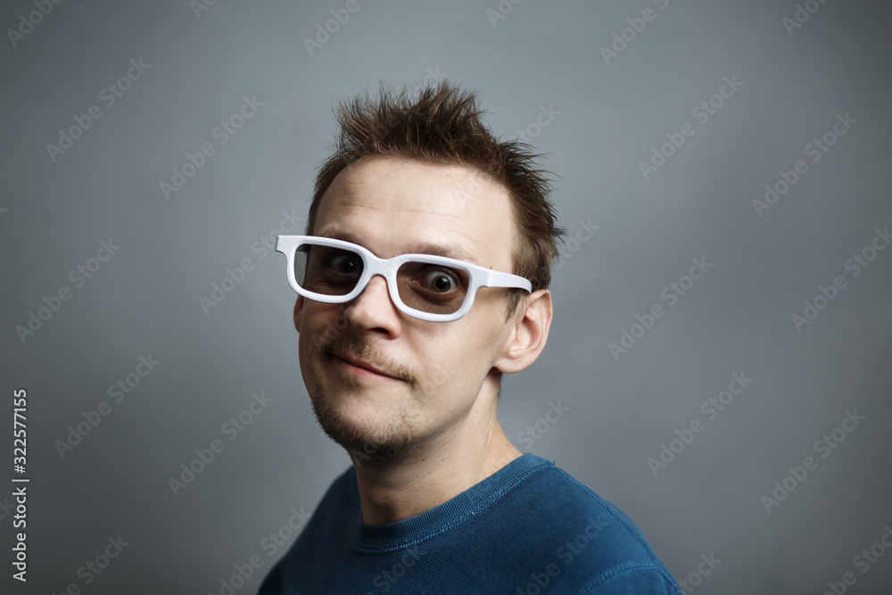 man in white 3D glasses emotionally watching movie man in white 3D glasses emotionally watching movie