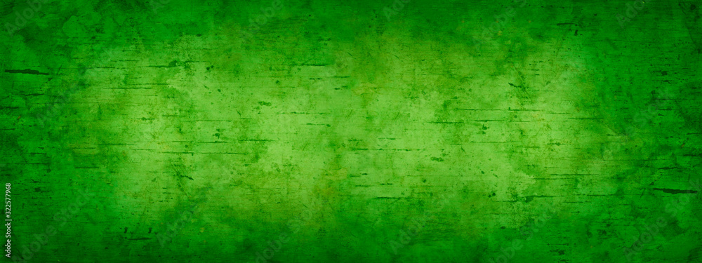 Abstract green yellow background for design. Toned old stained wood. Gradient. Light spot. Vintage. Wide banner. Panoramic. Copy space. Top view. 