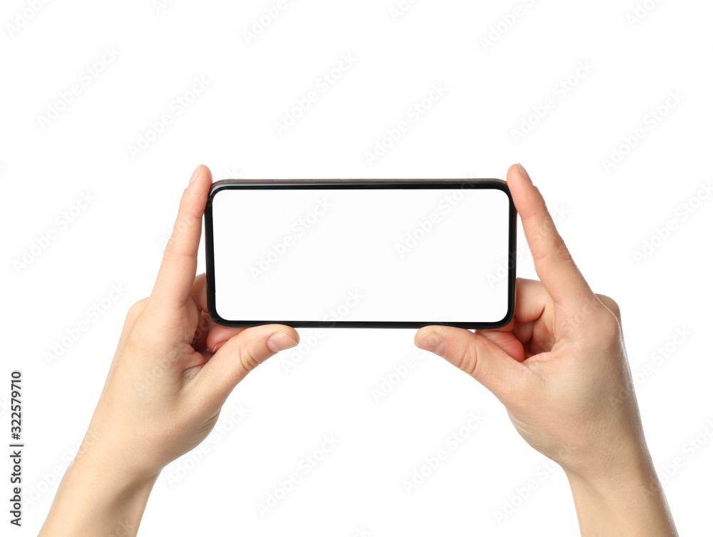 Female hands holding phone with empty screen, isolated on white background Female hands holding phone with empty screen, isolated on white background
