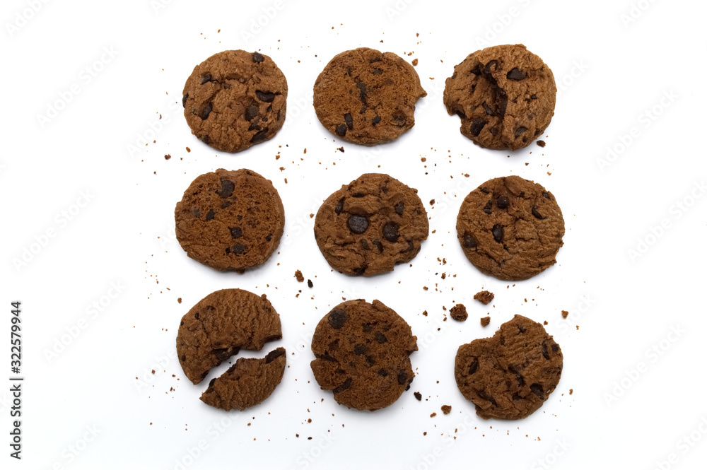 Set of chocolate chips cookies. Some broken and crumbs on white background in top view. Set of chocolate chips cookies. Some broken and crumbs on white background in top view.