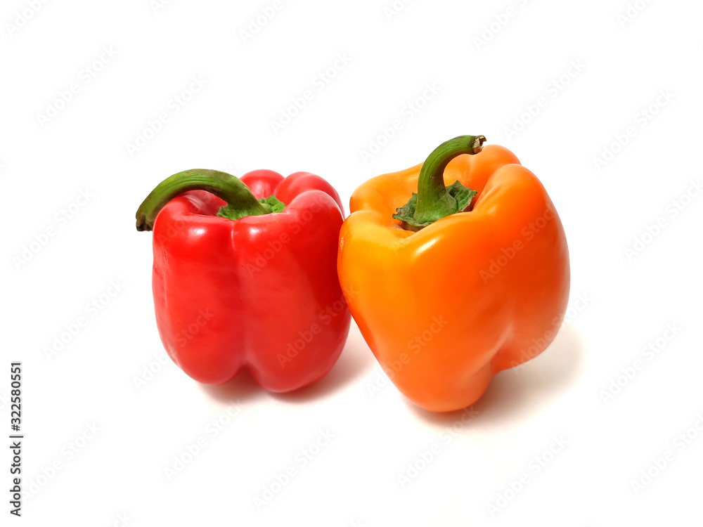 Red and orange peppers isolated on white background.