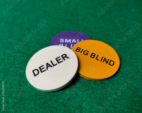 Obraz na plátně Chips dealer, big blind and small blind on the table on the green baize
