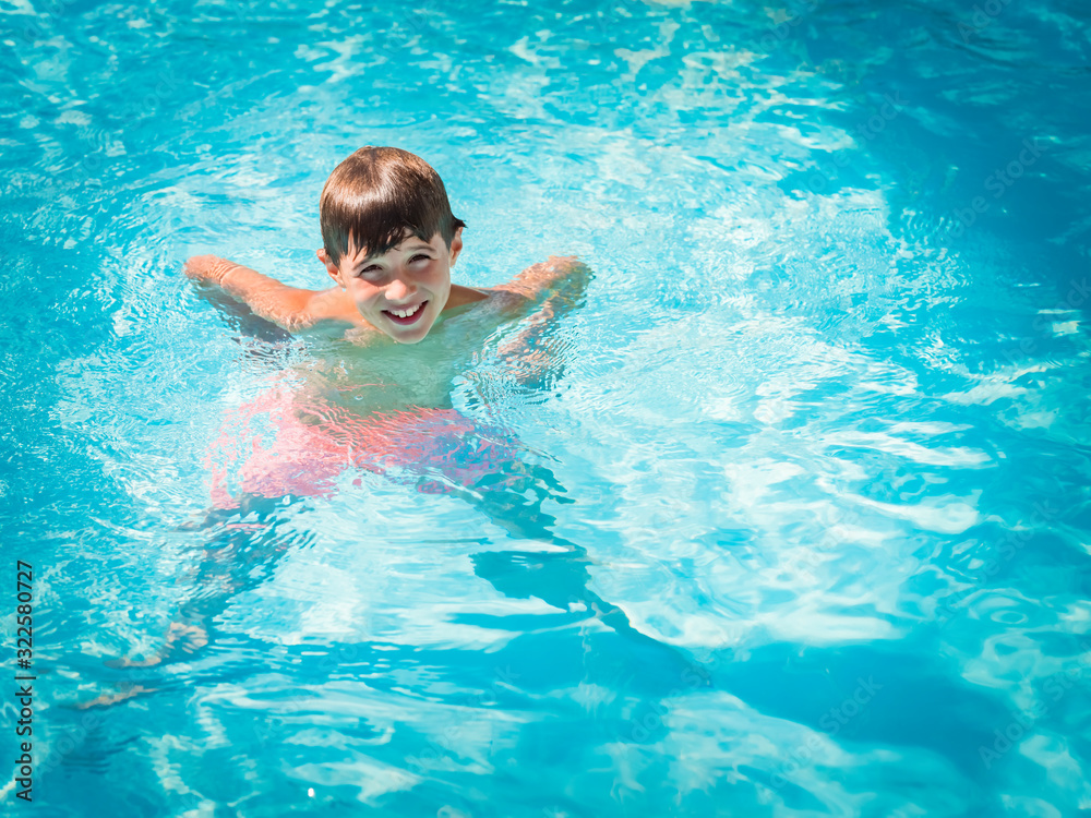Child playing in the swimming pool