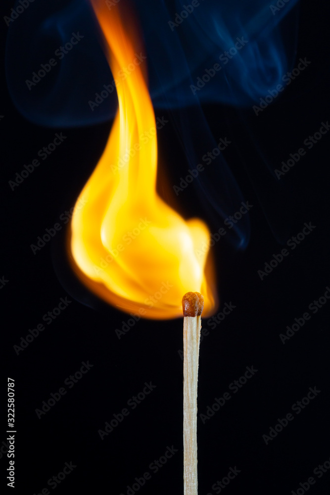 Flame and smoke on the matchsticks over black background