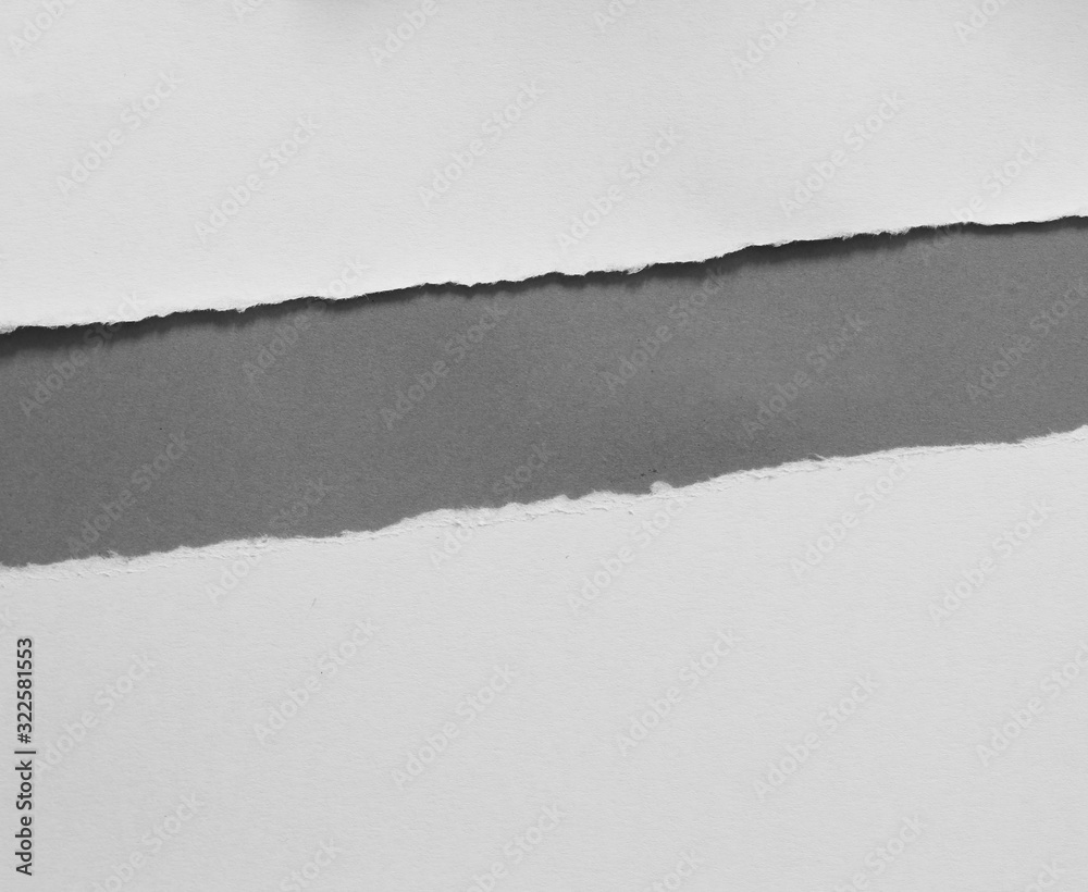 torn paper on gray background with copy space for text torn paper on gray background with copy space for text