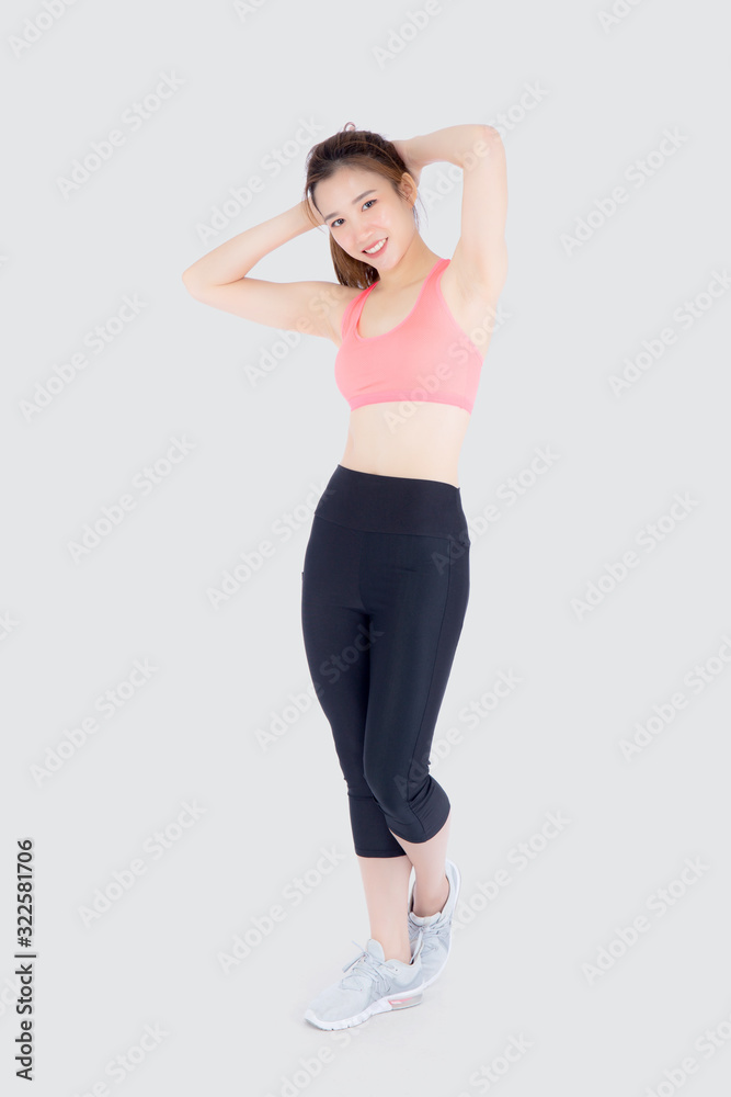 Beautiful portrait young asian woman standing workout stretch muscle arm with healthy isolated on white background, asia girl wear sport clothes exercise and yoga for health, wellness concept.