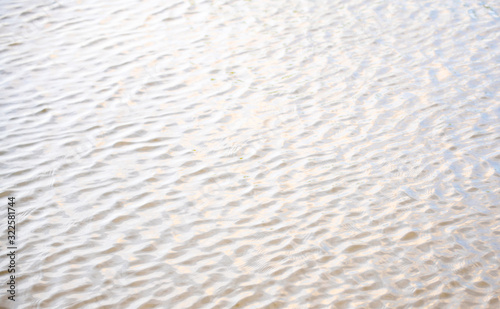 Sea of light with the surface of the water is a beautiful pattern appropriate the background , idea copy space