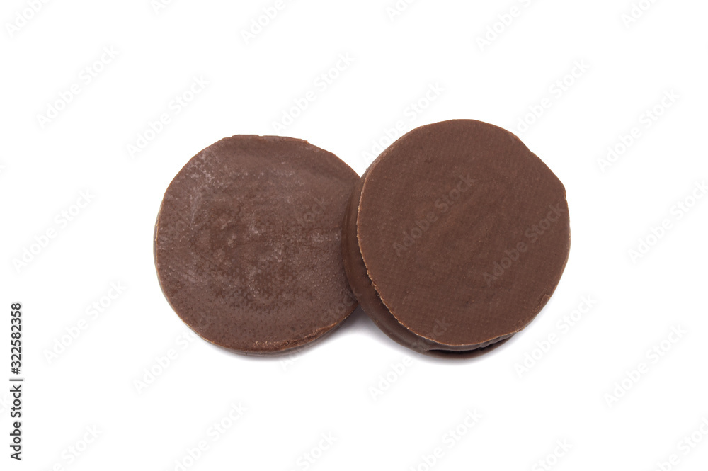 Chocolate sandwich cookies filled and coated with chocolate cream isolated on white background. Chocolate sandwich cookies filled and coated with chocolate cream isolated on white background.