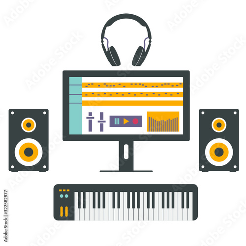 Home music studio equipment. Speakers, monitor, headphones and midi keyboard.