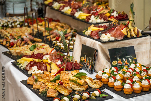 Catering buffet table with cold snacks. Delicious appetizers on the table, self serve.