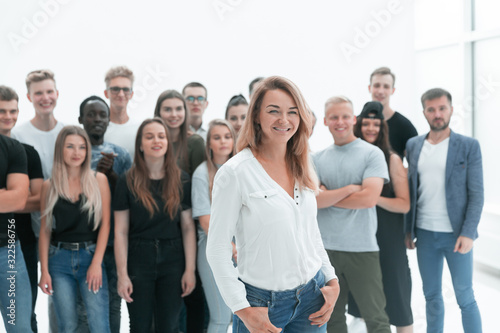 young woman standing in front of a group of diverse young people
