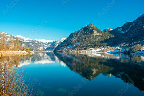 Grundlsee Lake in Austria, Beautiful landscape mountains and trees reflections in water, Austrian Alps in winter 
