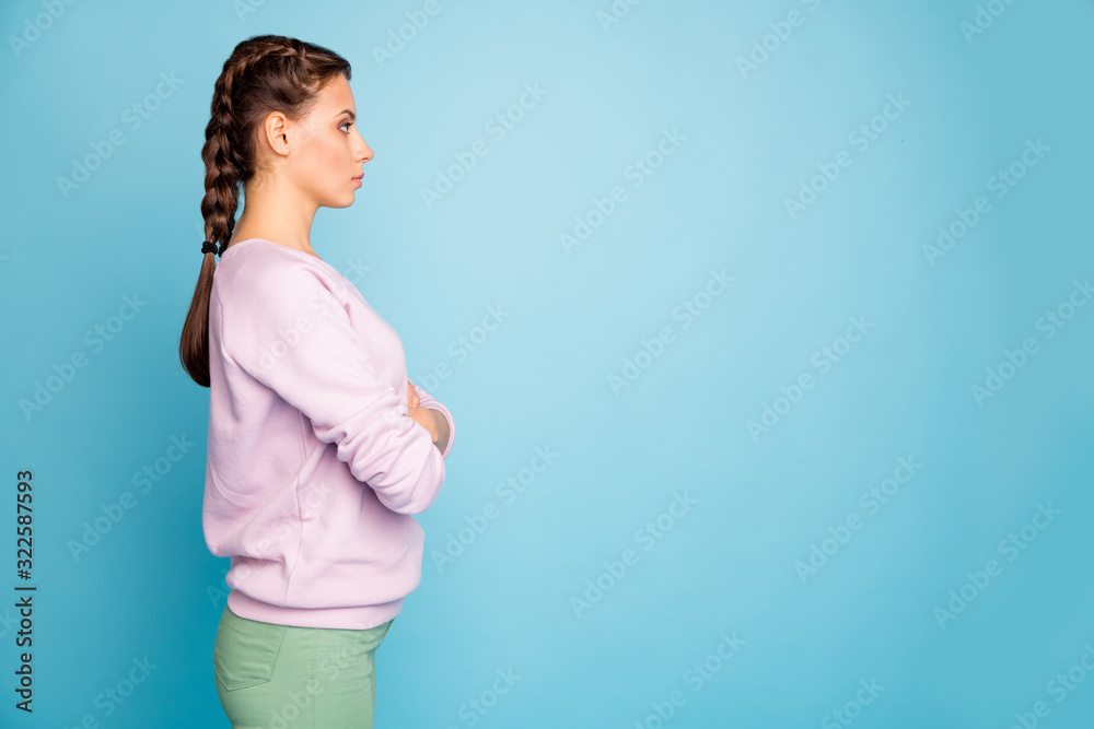 Profile side view portrait of her she nice attractive fashionable pretty content serious focused girl folded arms isolated over bright vivid shine vibrant blue green teal turquoise color background Profile side view portrait of her she nice attractive fashionable pretty content serious focused girl folded arms isolated over bright vivid shine vibrant blue green teal turquoise color background
