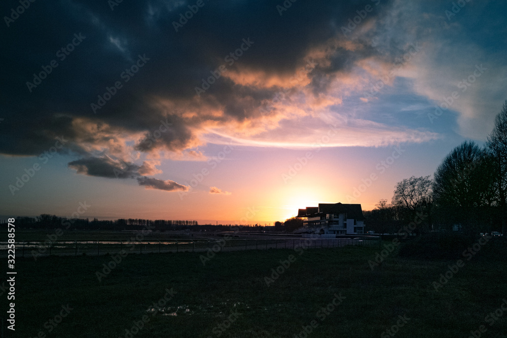 Flodded hippodrome at sunset in winter near Caen, Normandy