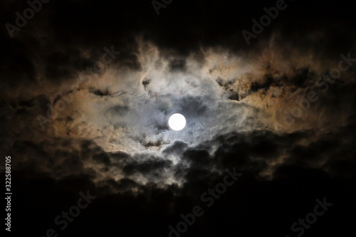 Full Moon, Snow Moon with billowing clouds