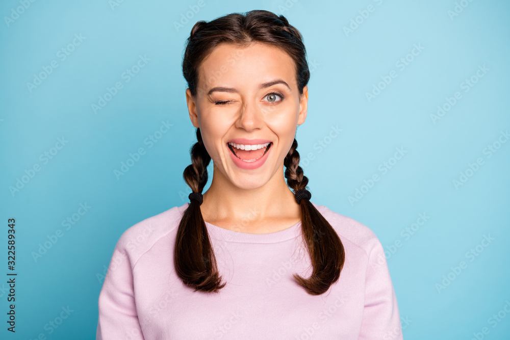 Close-up portrait of her she nice attractive lovely charming glad cheerful cheery girlish girl winking isolated on bright vivid shine vibrant blue green teal turquoise color background Close-up portrait of her she nice attractive lovely charming glad cheerful cheery girlish girl winking isolated on bright vivid shine vibrant blue green teal turquoise color background