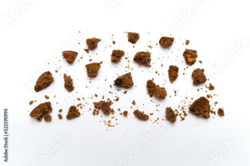 Biscuit with chocolate chip flavored. Some broken and crumbs of crunchy delicious sweet meal and useful cookie with on white background.