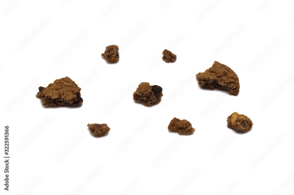 Obraz premium Cookies with chocolate chip flavored. Some broken and crumbs of crunchy delicious sweet meal and useful biscuits. Isolated on white background.
