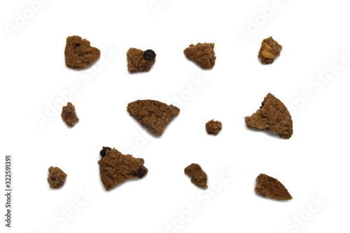 Cookies with chocolate chip flavored. Some broken and crumbs of crunchy delicious sweet meal and useful biscuits. Isolated on white background.