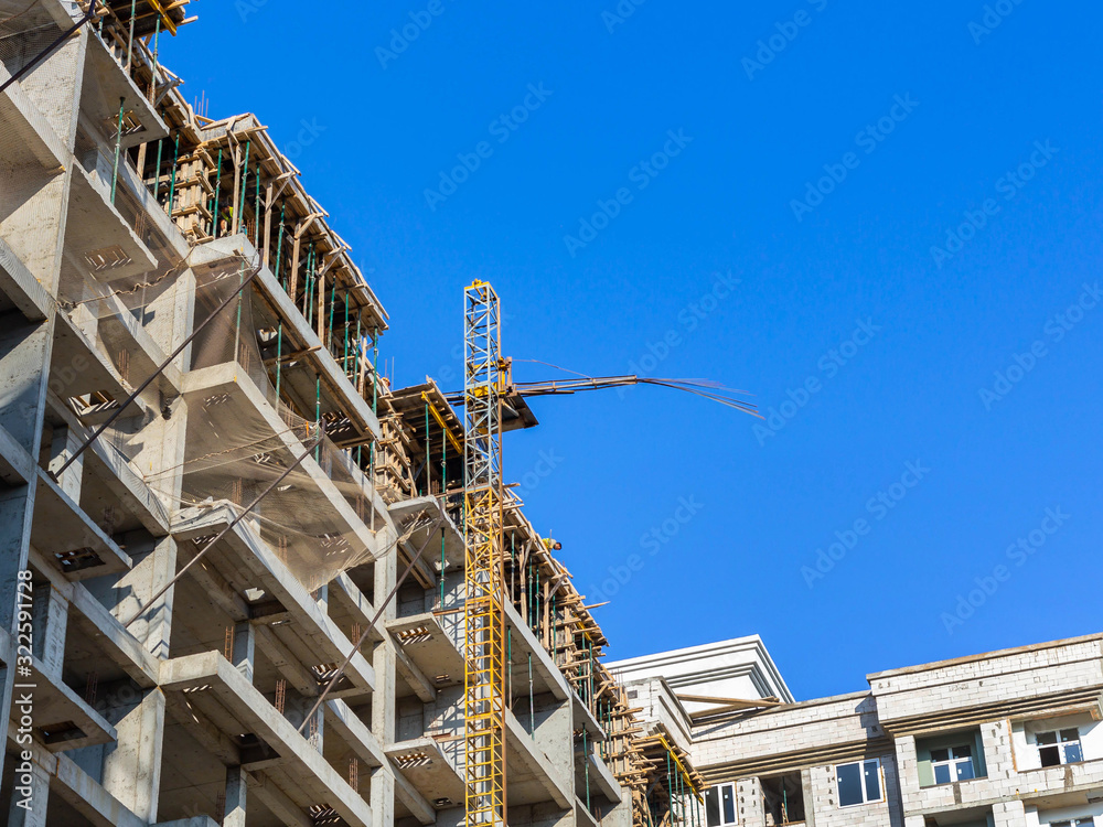 Lift for building materials in the construction of a high-rise building