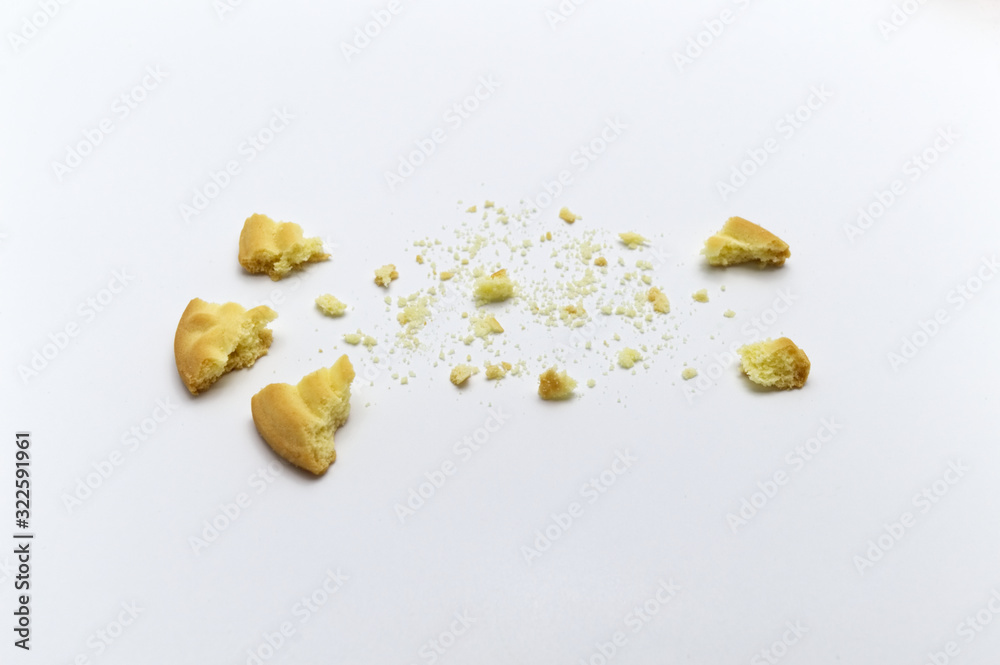 Sandwich cookies filled with coffee cream flavored. Some broken and crumbs of crunchy delicious sweet meal and useful cookie on white background. Sandwich cookies filled with coffee cream flavored. Some broken and crumbs of crunchy delicious sweet meal and useful cookie on white background.