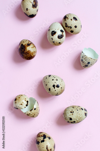 Quail eggs on a pastel pink background