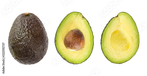 Whole ripe avocado fruit and two halves in a row isolated on white background.