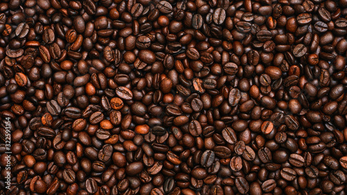 Many brown coffee beans  can be used as a background