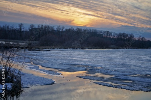 Brilliant winter sunset over Purgatory Creek in Minnesota