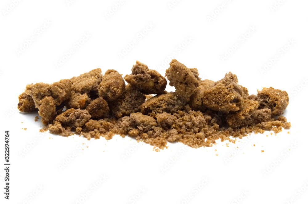 Crumbs of cookies with chocolate chip butter flavored on white background. Crumbs of cookies with chocolate chip butter flavored on white background.
