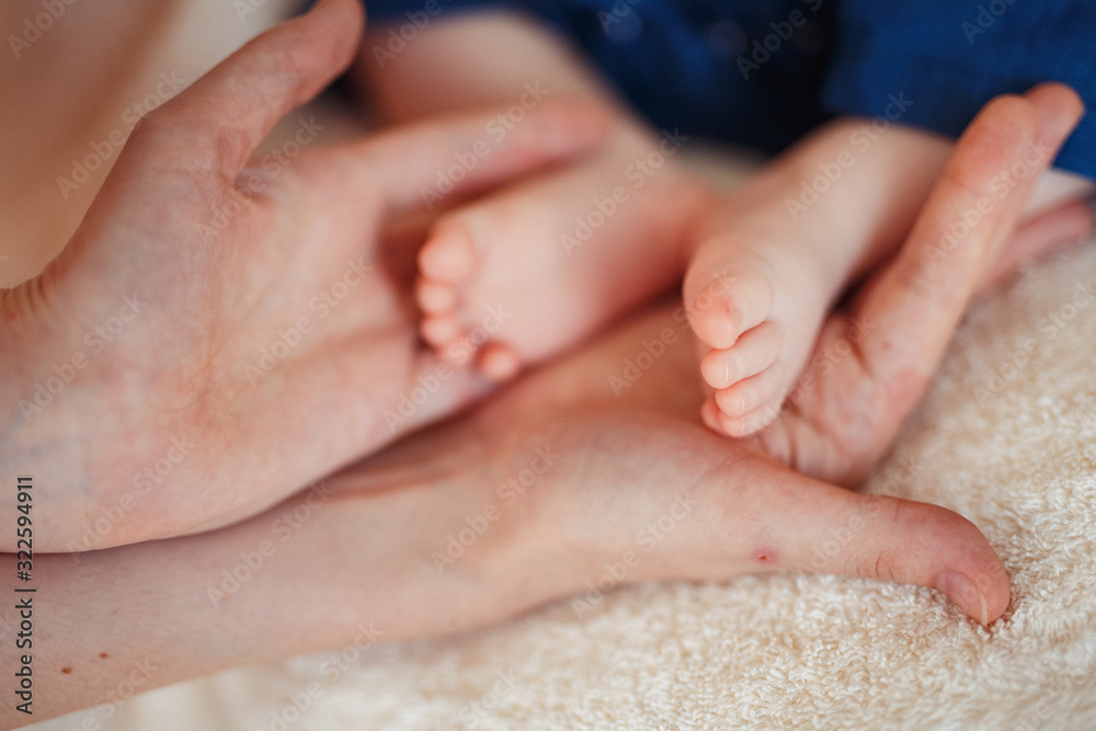 Close up photo of a baby foot in mother hands. Close up photo of a baby foot in mother hands.