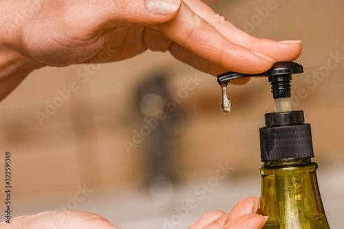 A Washing hands with soap under the faucet with water