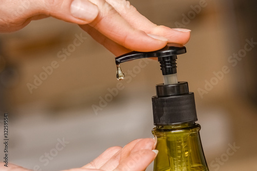 A Washing hands with soap under the faucet with water