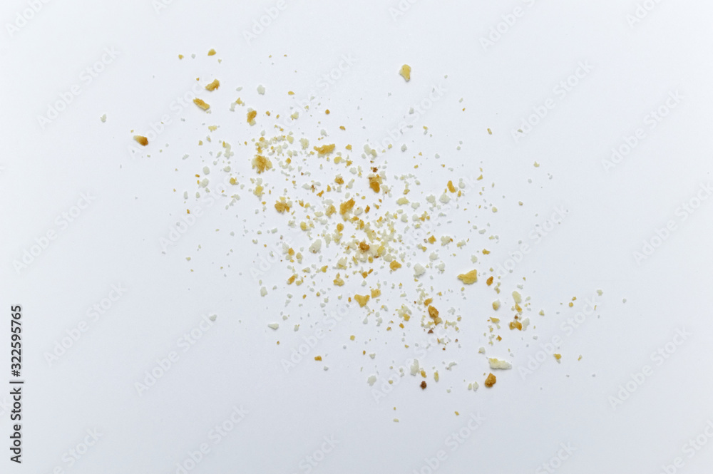 Scattered crumbs of cookies on white background. Scattered crumbs of cookies on white background.