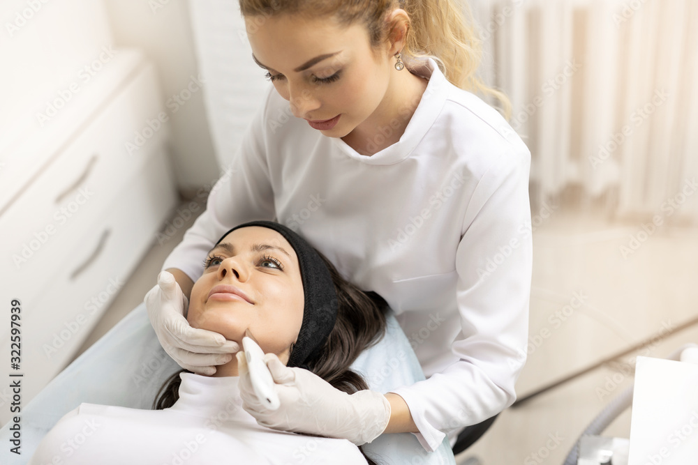 Beauty woman in the beauty salon on Spa treatment. Ultrasonic face peel. Skin care. Fashion, beauty, makeup, cosmetics, health, spa, wellness. Beauty woman in the beauty salon on Spa treatment. Ultrasonic face peel. Skin care. Fashion, beauty, makeup, cosmetics, health, spa, wellness.