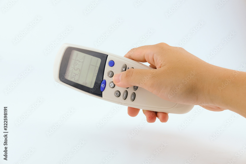 Close up hand women using remote controller open The air conditioner on White Background. Health, Technology and Electronic Equipment concept. Close up hand women using remote controller open The air conditioner on White Background. Health, Technology and Electronic Equipment concept.
