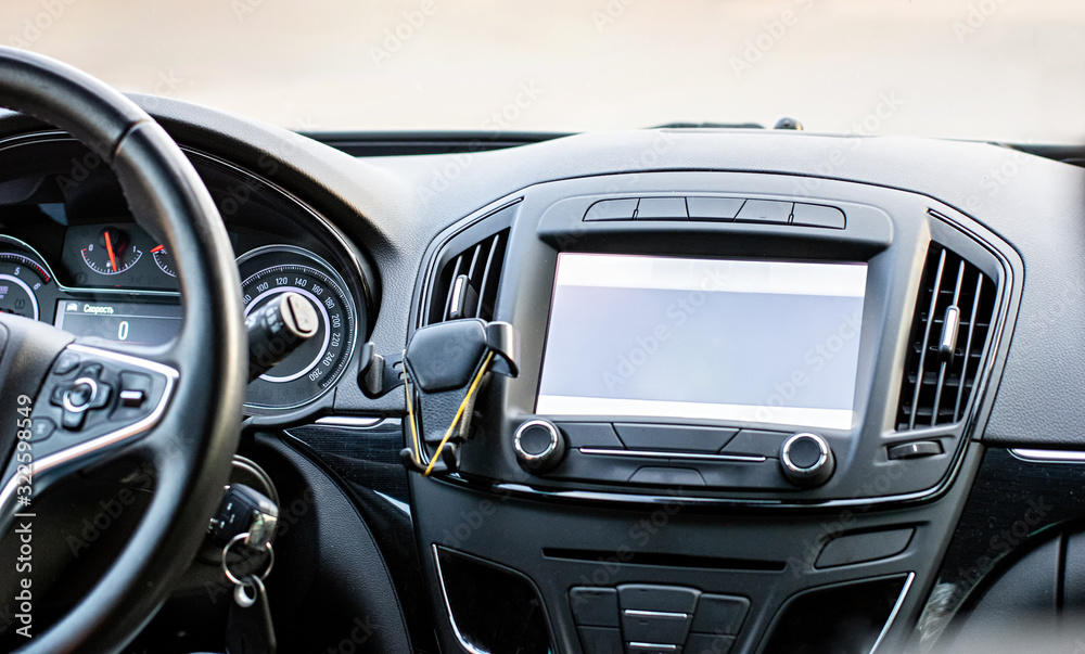 Car navigation system. GPS device in car help driver to find the way. Blank screen with place for text.