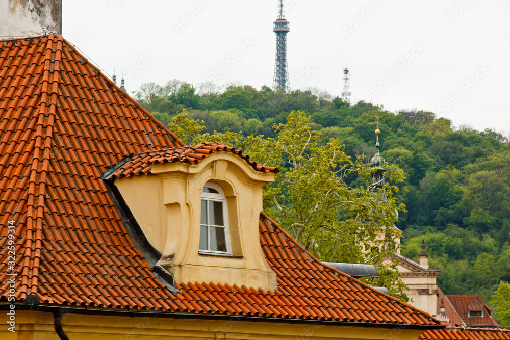 Prague. 05.10.2019: Low light detail of patina red roof top. Prague Lesser Town typical roofing material. Old roofing of clay tiles. Various orange shades and stains. Prague. 05.10.2019: Low light detail of patina red roof top. Prague Lesser Town typical roofing material. Old roofing of clay tiles. Various orange shades and stains.