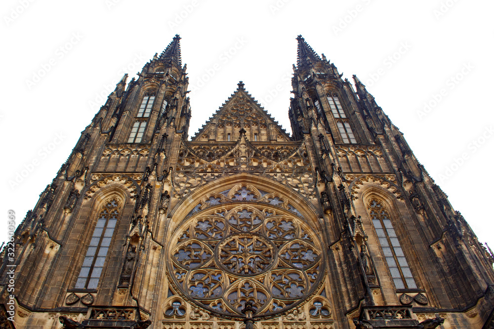 Fototapeta premium Prague. 05.10.2019: Perspective view of the Metropolitan Cathedral of Saints Vitus, Wenceslaus and Adalbert, an excellent example of Gothic architecture. Golden Gate South Tower with clock.