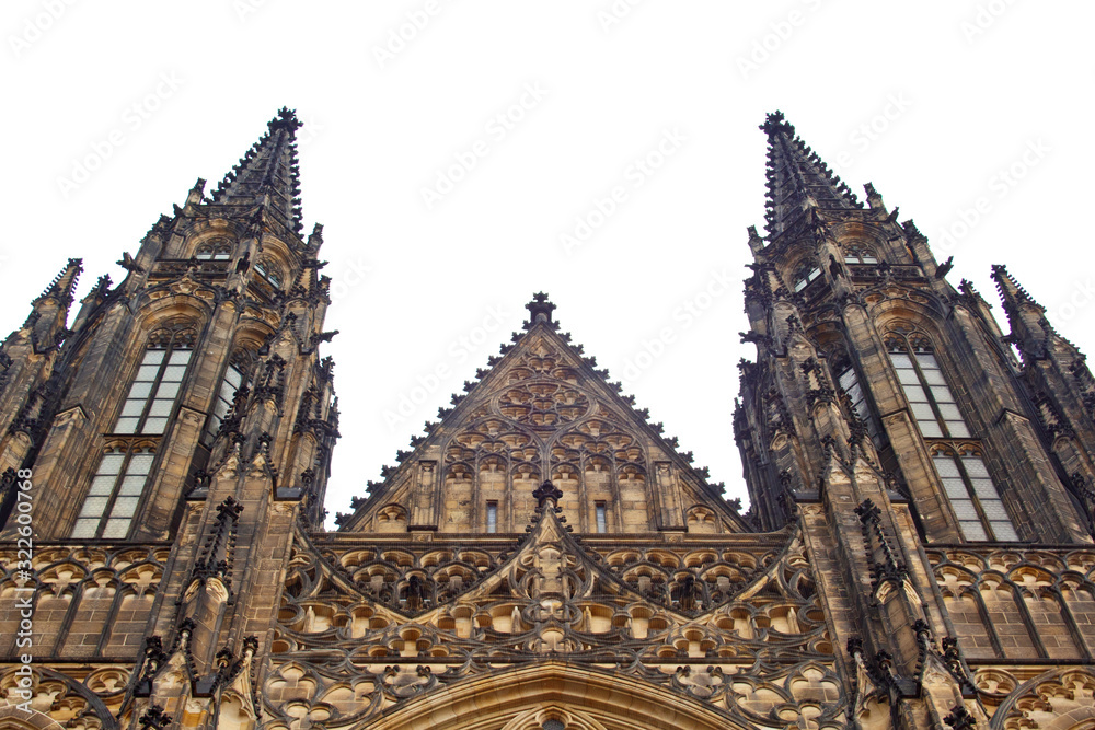 Fototapeta premium Prague. 05.10.2019: Perspective view of the Metropolitan Cathedral of Saints Vitus, Wenceslaus and Adalbert, an excellent example of Gothic architecture. Golden Gate South Tower with clock.