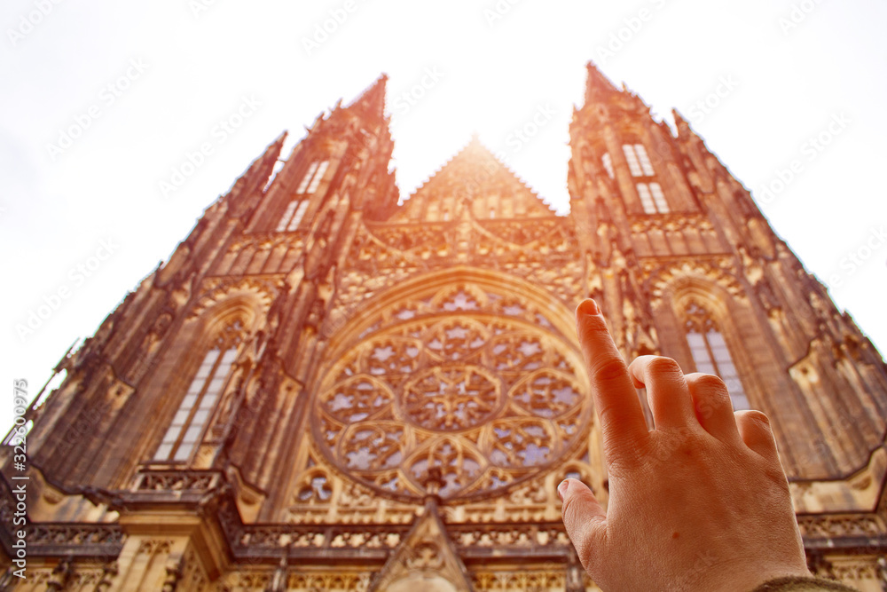 Obraz premium Prague. 05.10.2019: Perspective view of the Metropolitan Cathedral of Saints Vitus, Wenceslaus and Adalbert, an excellent example of Gothic architecture. Golden Gate South Tower with clock.