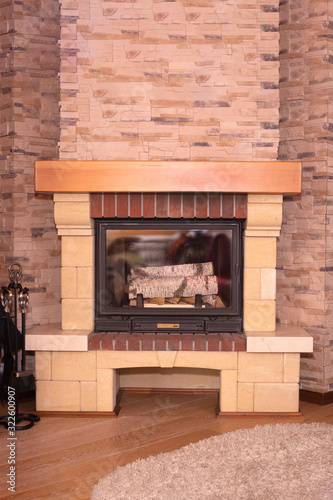 modern stone fireplace with wood