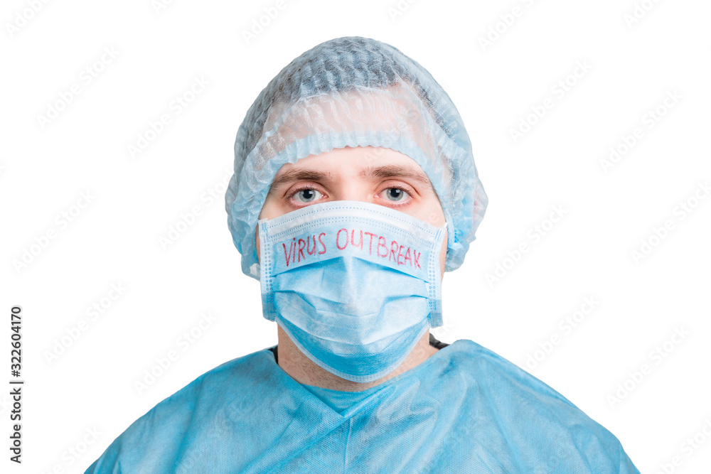 Portrait of handsome man wearing medical uniform and mask with virus outbreak word isolated on white background. Protect your health. Coronavirus concept Portrait of handsome man wearing medical uniform and mask with virus outbreak word isolated on white background. Protect your health. Coronavirus concept