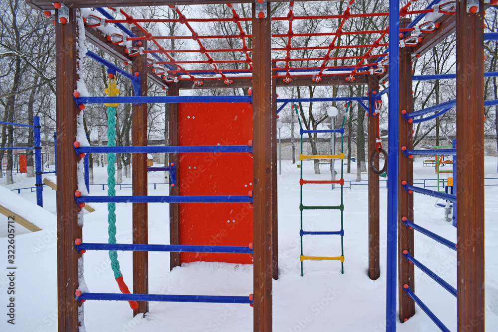 Colorful playground after winter snow.