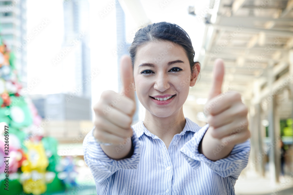 Western ethnic women work as office workers. Thumbs up. Pleasing, happy. Western ethnic women work as office workers. Thumbs up. Pleasing, happy.