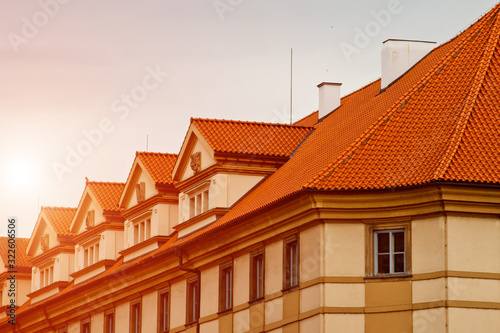 Prague. 05.10.2019: Orange colored roof tops of Prague old town buildings and baroque style houses viewed from top of old town hall tower, Prague, Czech Republic. Panorama.